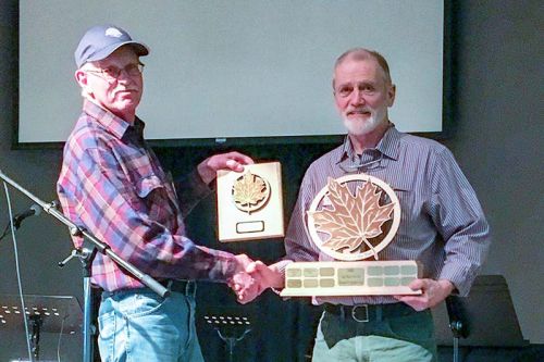 Lanark & District maple syrup producer, Dwight James (right), was presented with the Sugar Maker of the Year award by LDMSPA President, Harold Walker (left). The Sugar Maker of the Year is a prestigious award presented to long term maple producers, or those that encourage and support start-ups in maple production.